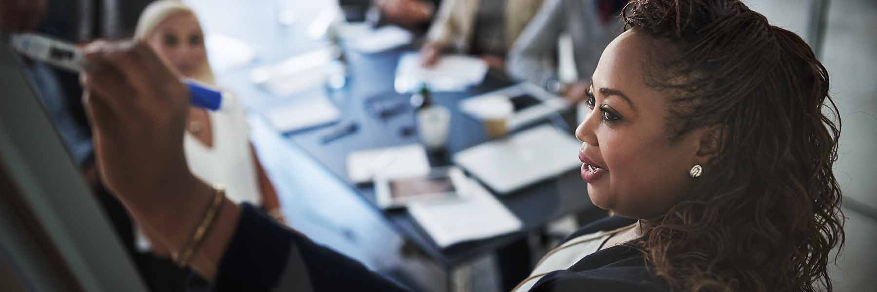 Woman leads a discussion in a classroom